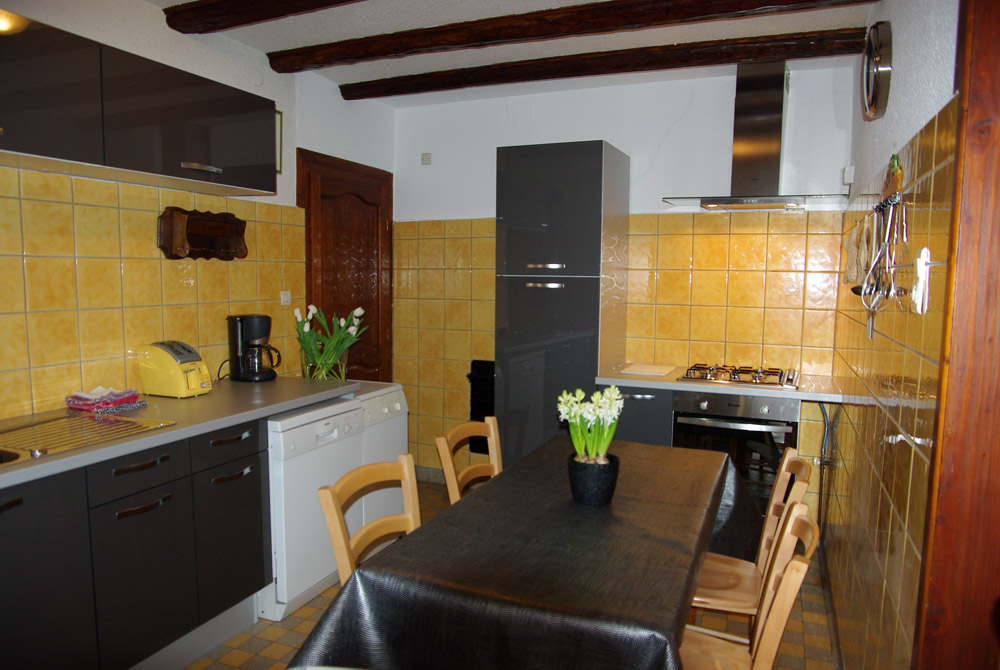 A comfortable kitchen, equipped with washmachine, dishmachine, micro-wave, great place of arrangements